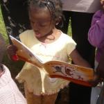 little girl reading thank you web size