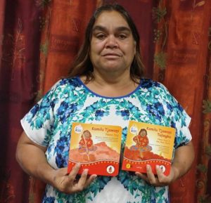 Kathy Wiseman with Honey Ant Readers baby board books in several indigenous Australian languages